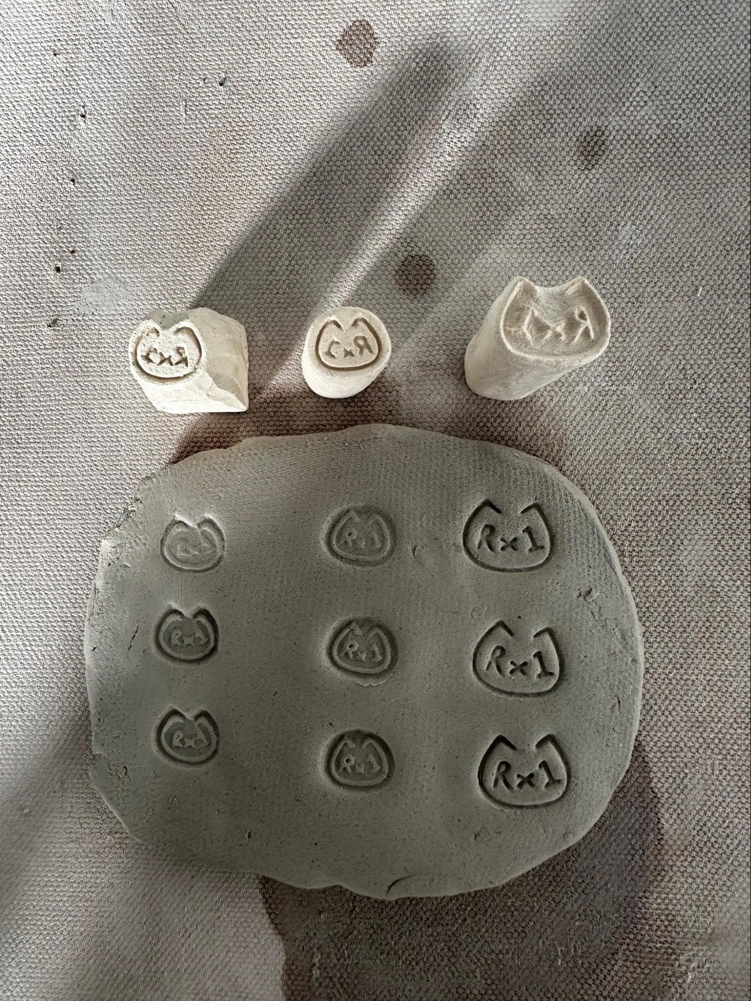 Stamp Prototypes · includes initials, period and design · explored handles, carving and sculpting — Ceramic work by RuiXuan Xu — School